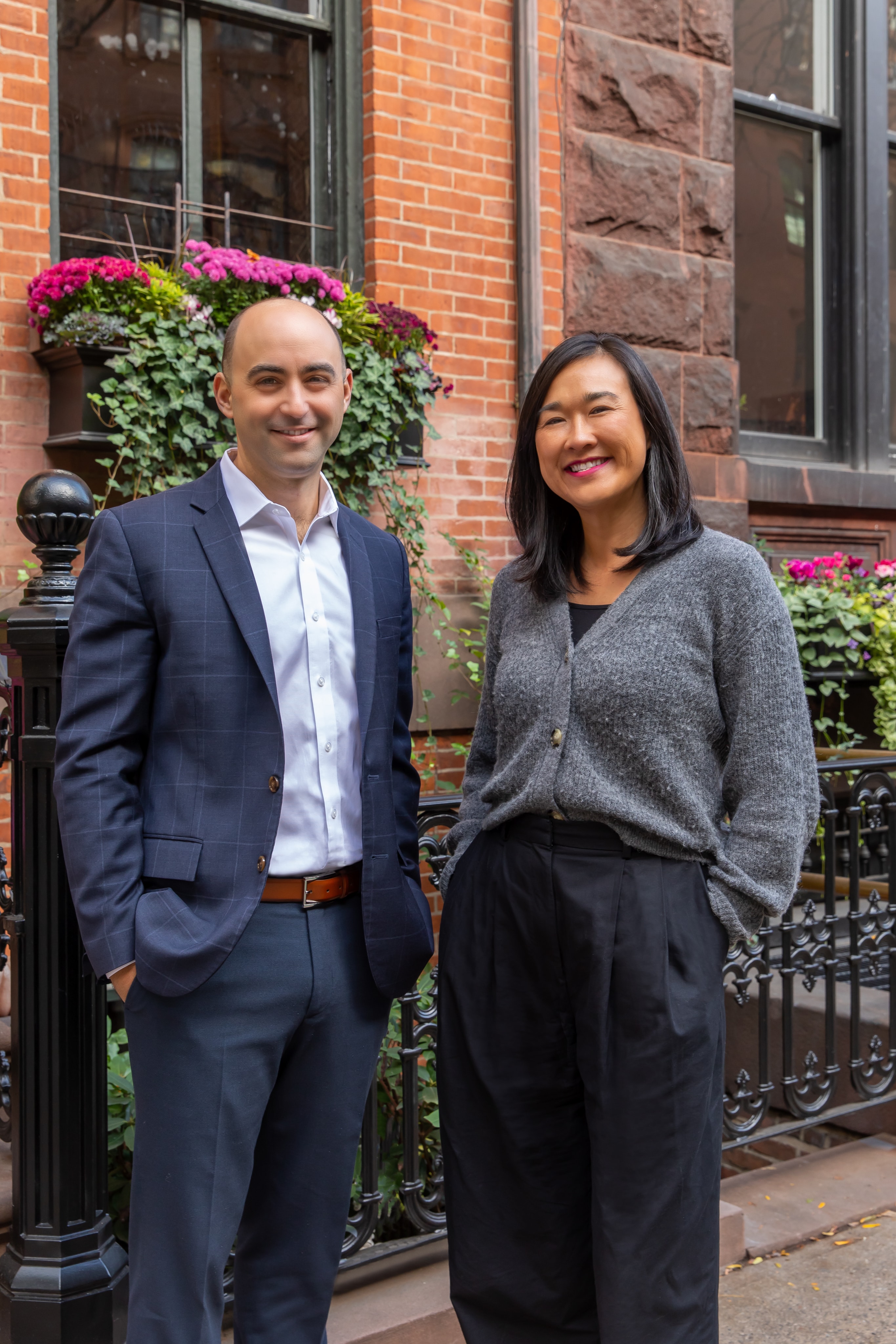 Ian Katz and Wendy Tsang outside a brownstone