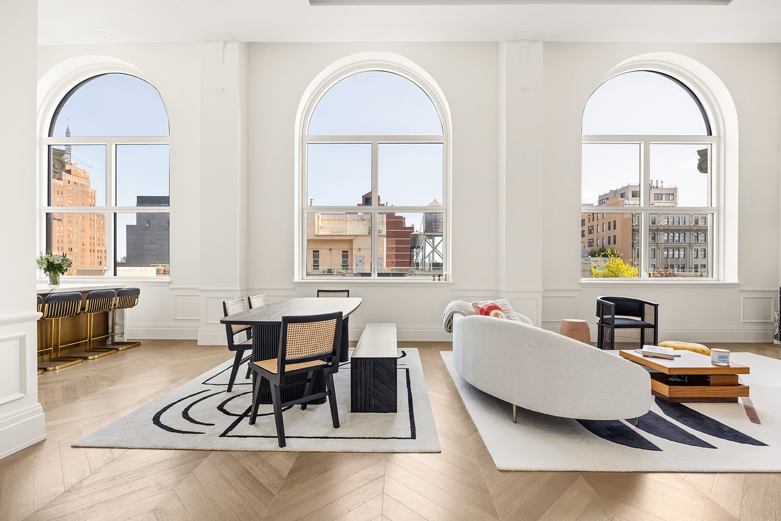A Tribeca loft's arched windows over the rooftops